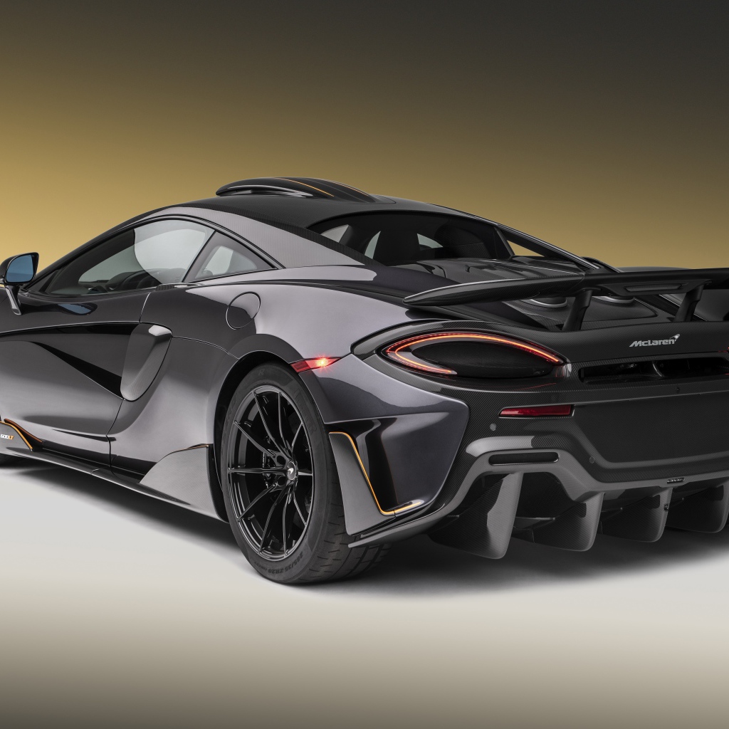 Черный спортивный автомобиль  McLaren 600LT, 2019 года вид сзади