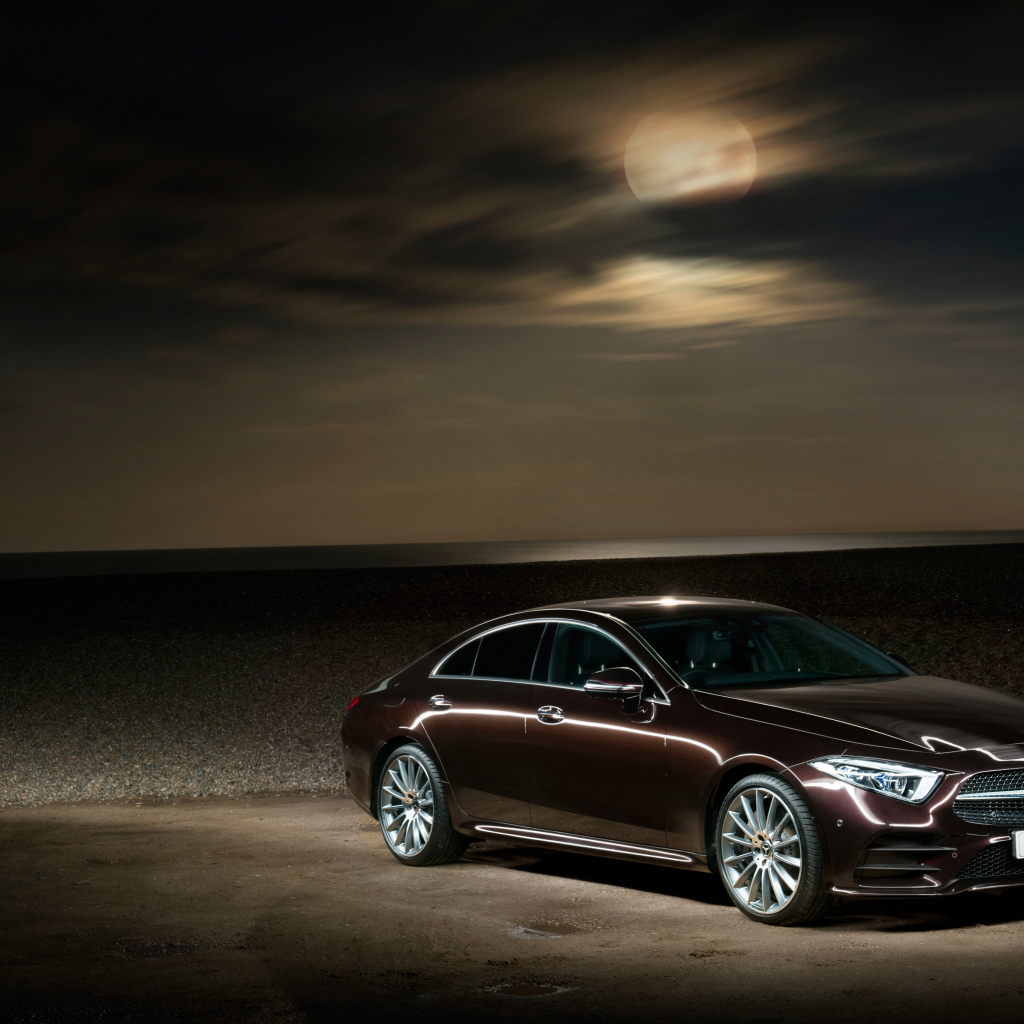 Brown Mercedes Benz CLS 400 D AMG 2018 in the background of the moon