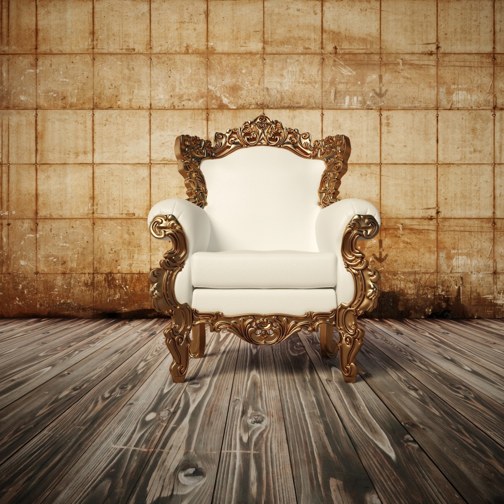 Белое новое кожаное кресло на деревянном полу у старой стены