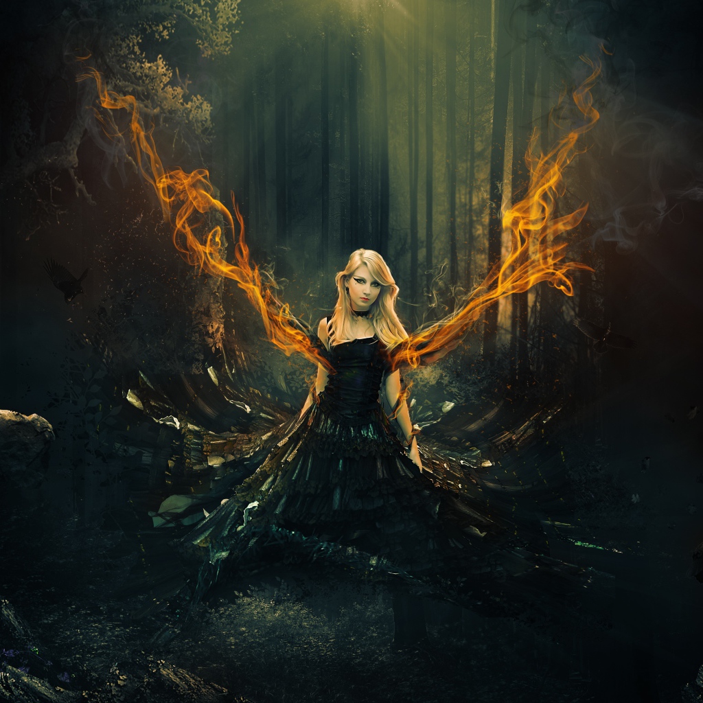 Фантастическая девушка в черном платье с огненными крыльями