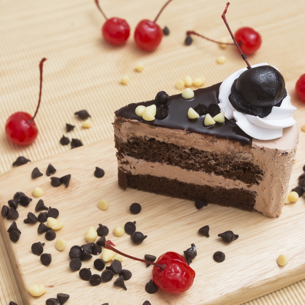 Appetizing piece of cake with chocolate and cherry berries