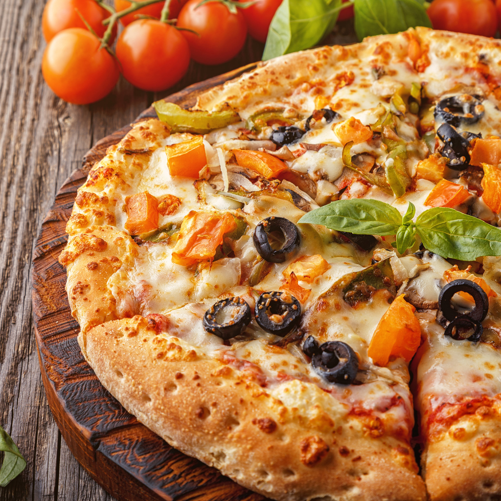 Appetizing pizza with olives on the table