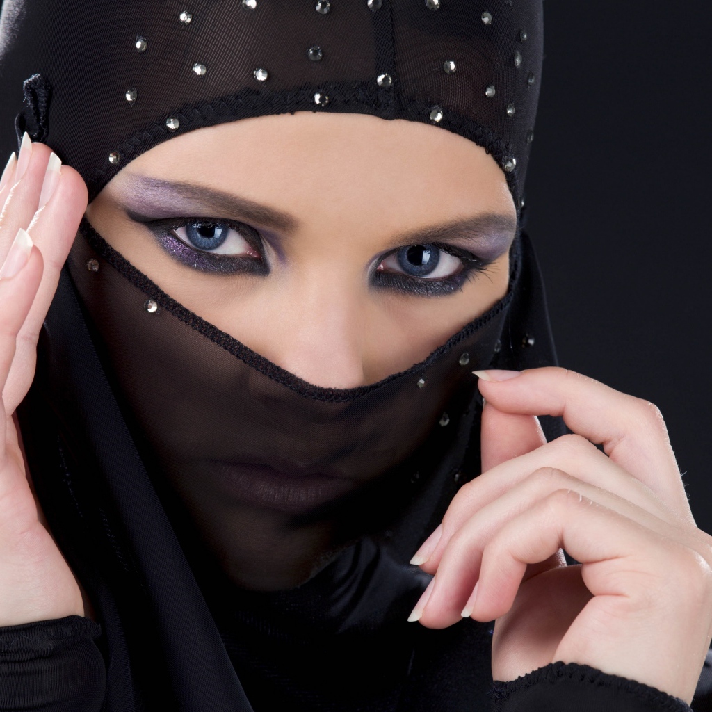 Beautiful oriental girl in a black veil