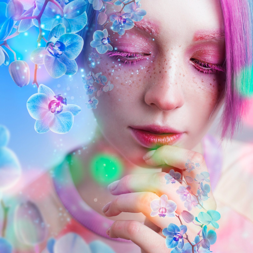 Молодая девушка с розовым макияжем в окружении цветов