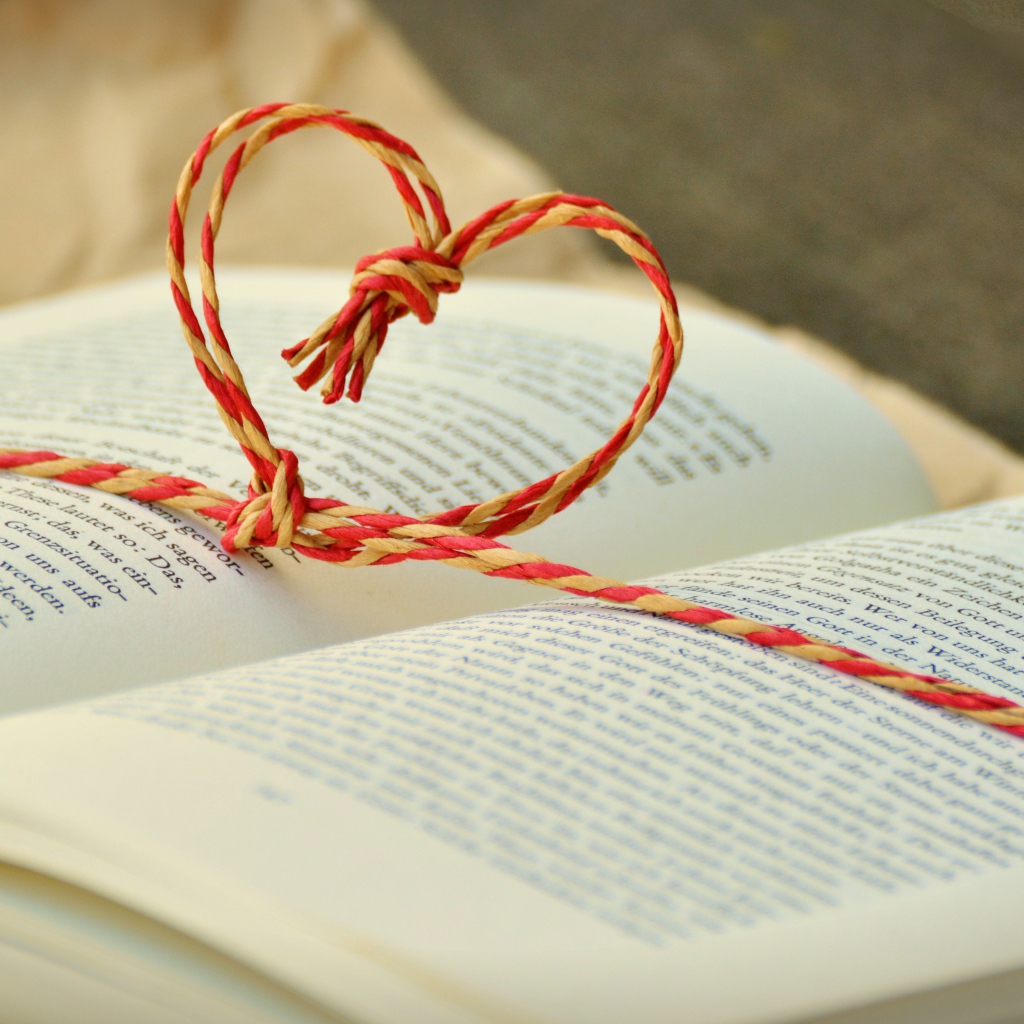 The heart of the rope lies on an open book