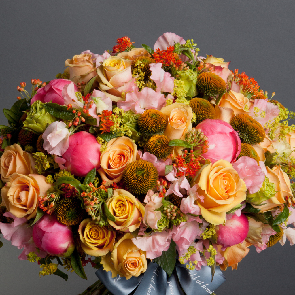Large beautiful bouquet of flowers on a gray background