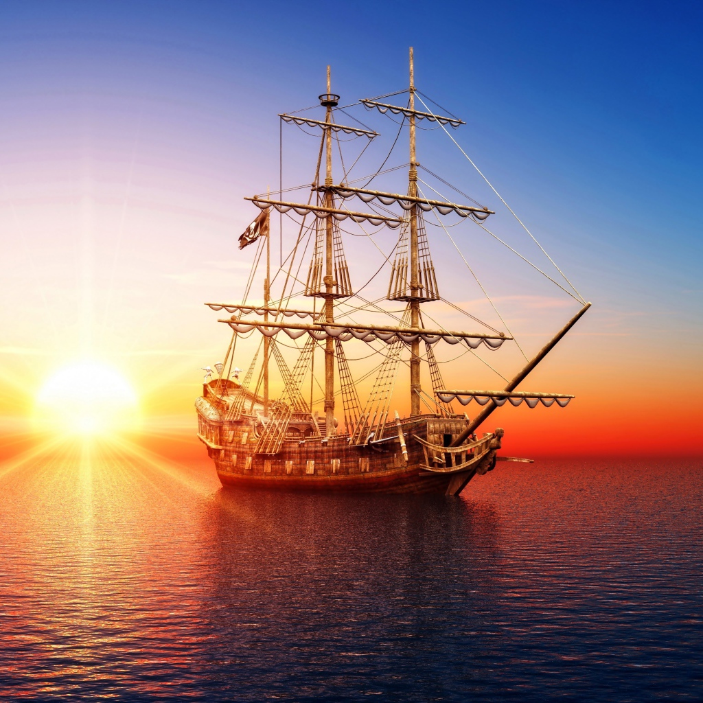 Big pirate ship in the sea at sunset
