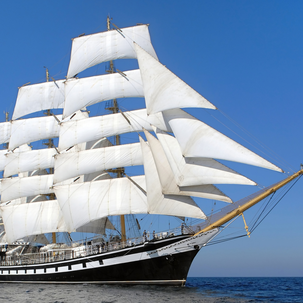 Big ship with white sails in the sea