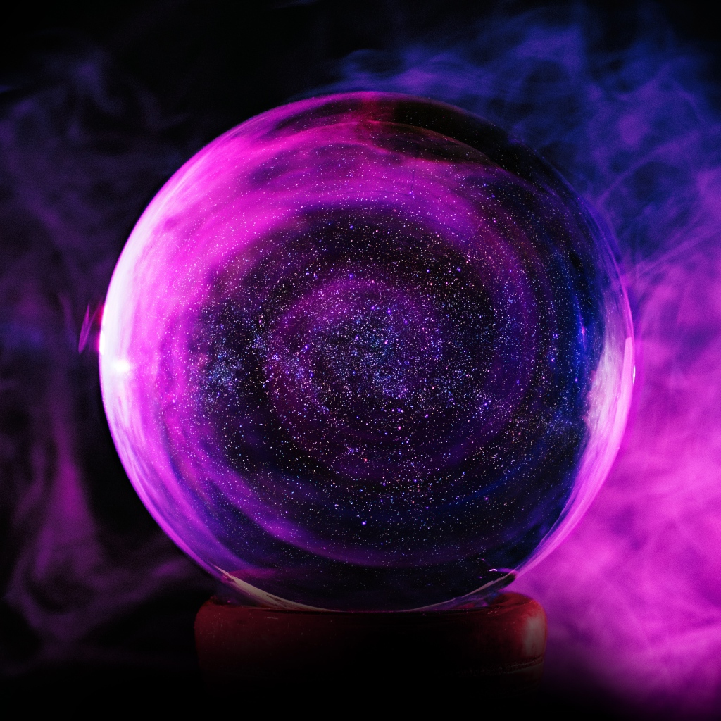 Large crystal ball in smoke on a black background