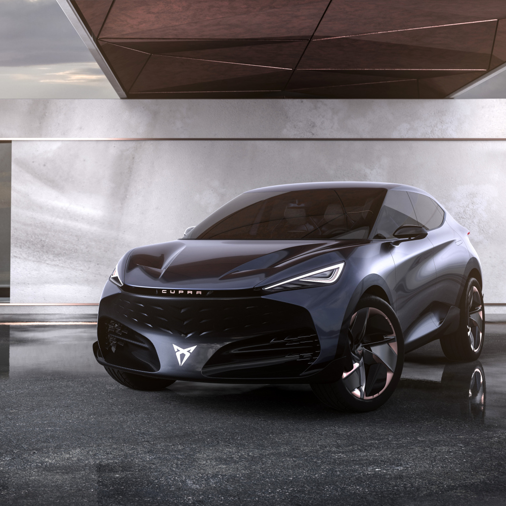 Черный автомобиль Cupra Tavascan Concept в здании 