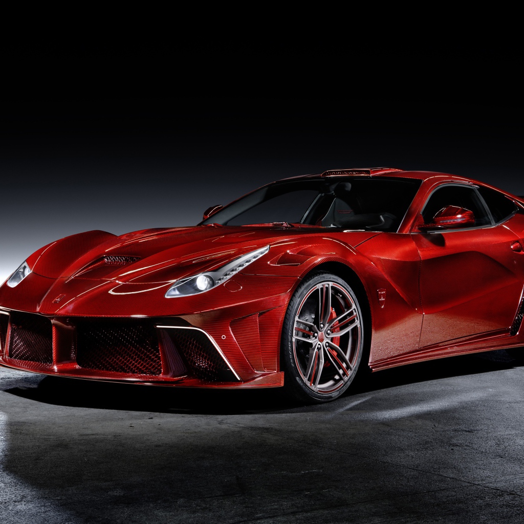 Красный автомобиль Mansory La Revoluzione на сером фоне