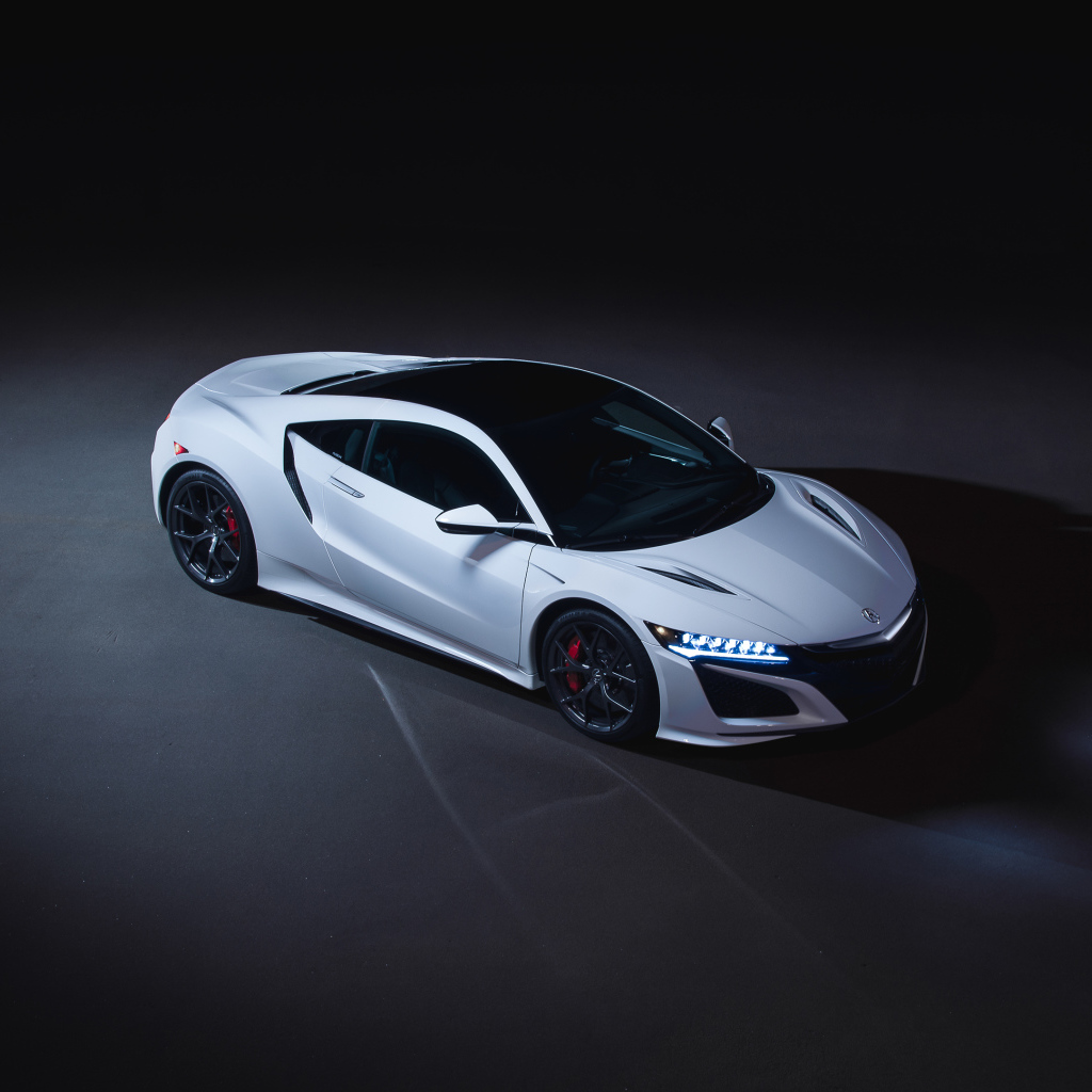Белый автомобиль Acura NSX 2019 года на сером фоне