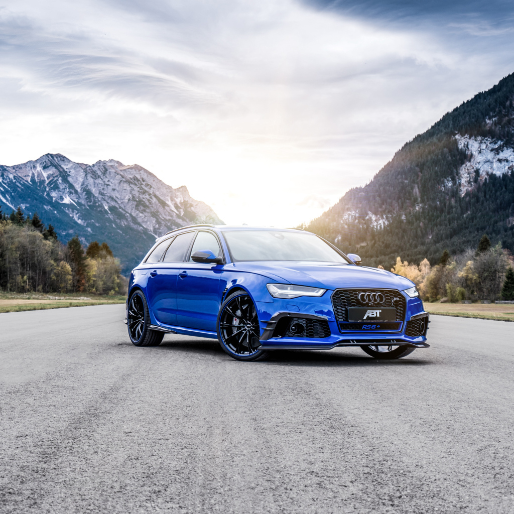 Blue Audi RS 6 on the background of mountains on the road