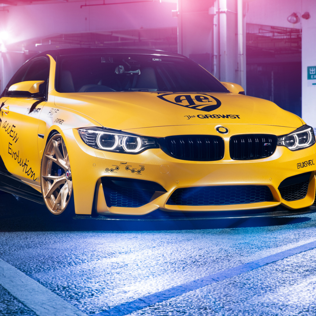 Yellow BMW M4 in the garage