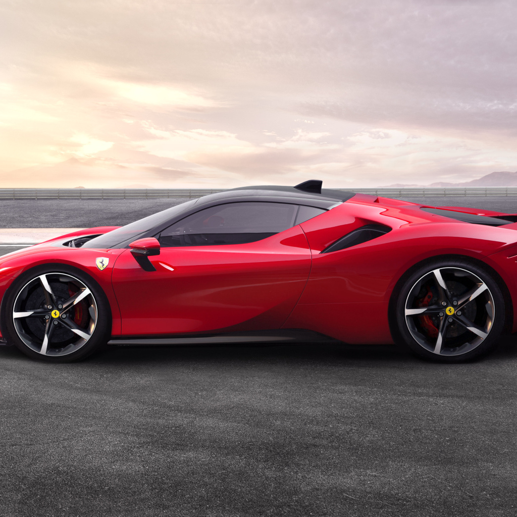 Красный спортивный автомобиль Ferrari SF90, 2019 года вид сбоку
