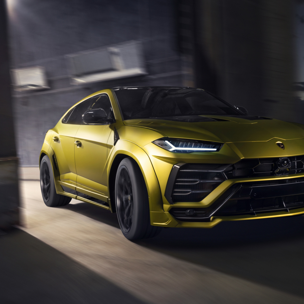 Yellow 2019 Lamborghini Urus Esteso car drives out of garage