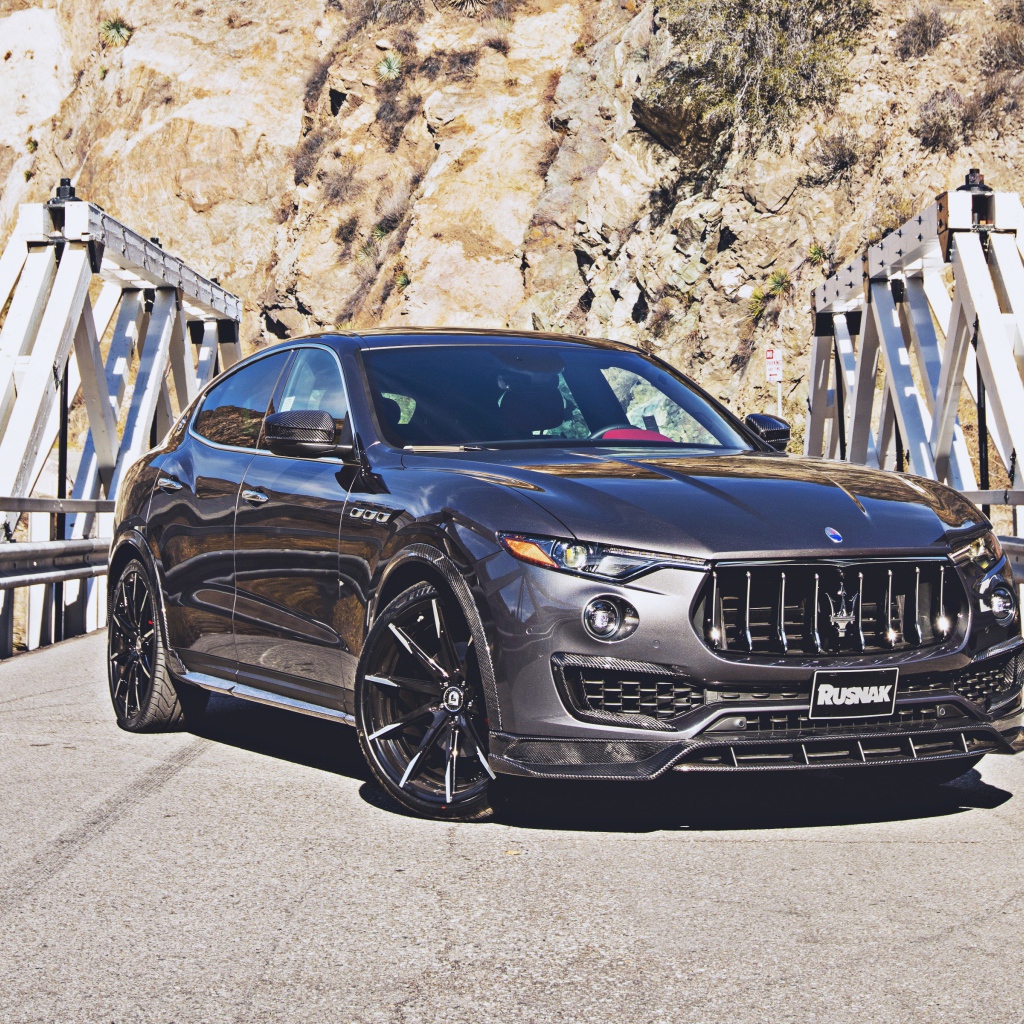 SUV Maserati Levante on the bridge in the background of the mountains