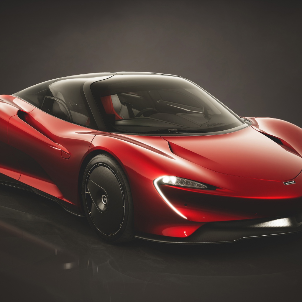 Красный автомобиль McLaren Speedtail Bloodline 2019 года на черном фоне