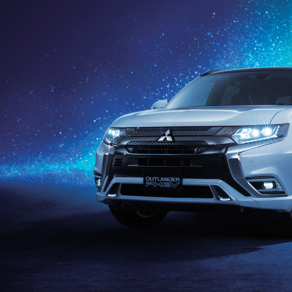 Внедорожник Mitsubishi Outlander  2018 года на неоновом фоне
