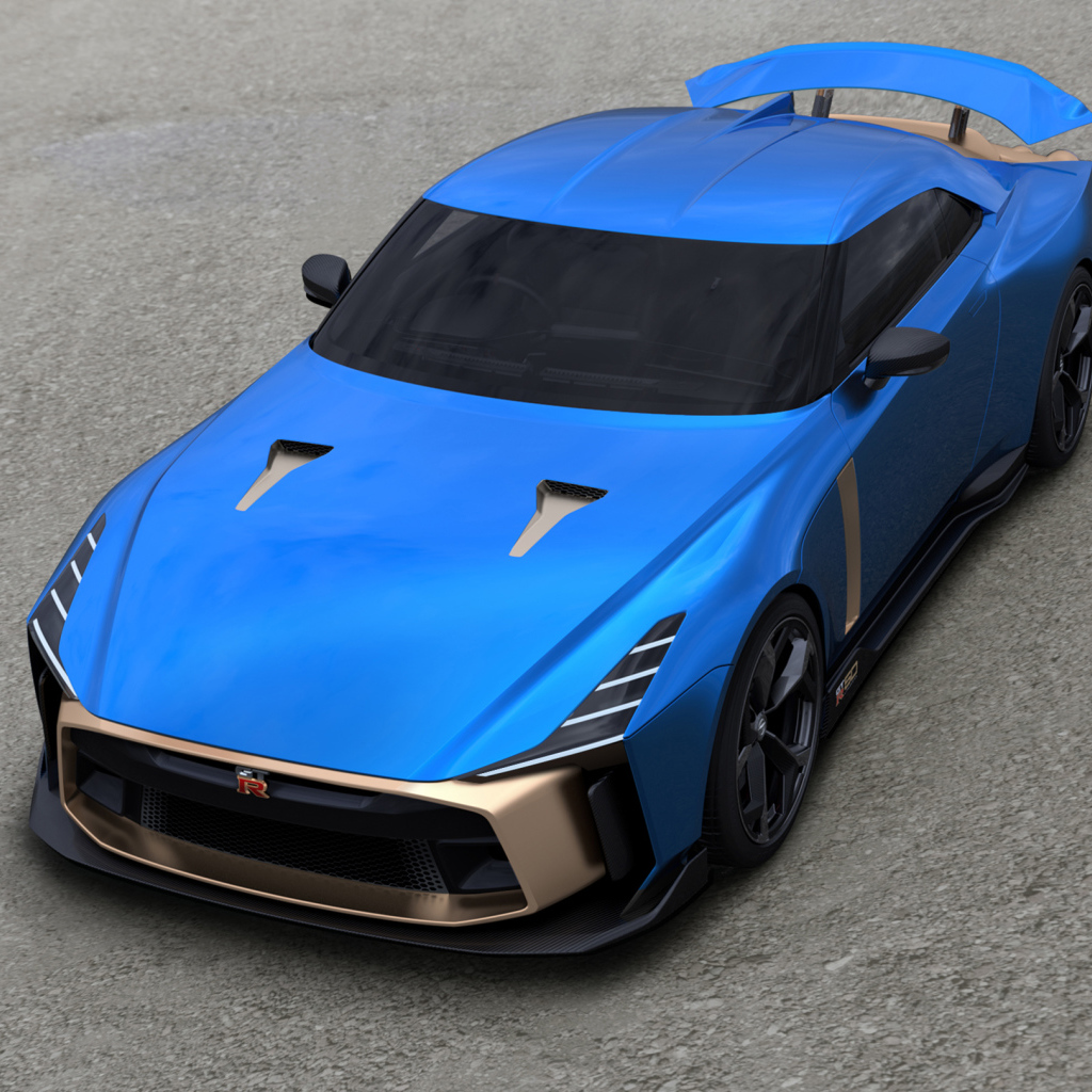 Синий автомобиль Nissan GT-R50 2019 года на сером асфальте