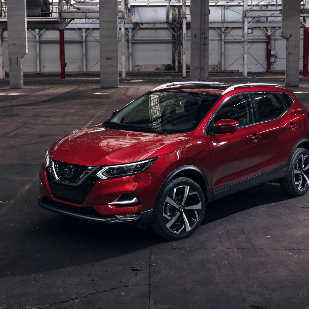 Красный автомобиль Nissan Rogue 