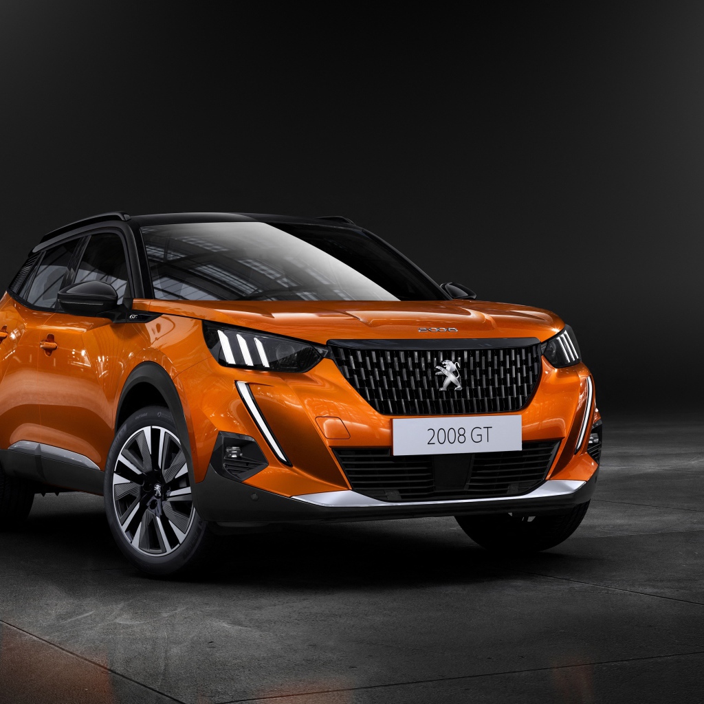 Оранжевый внедорожник Peugeot 2008 GT, 2019  года на сером фоне
