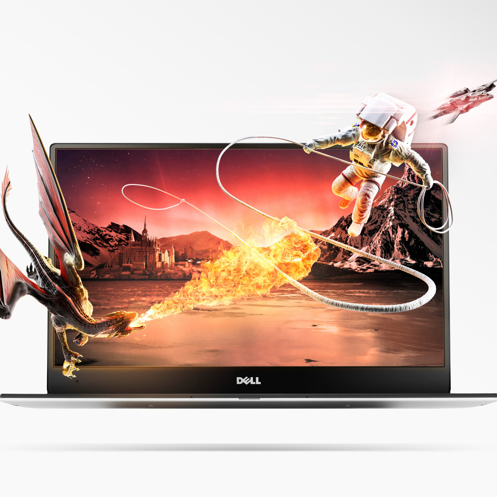 Дракон и астронавт вылетают из ноутбука Dell на белом фоне