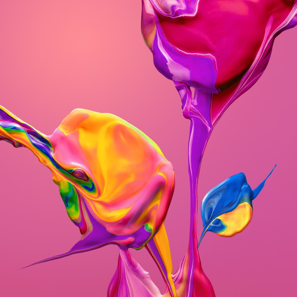 Разноцветные краски смешиваются на розовом фоне