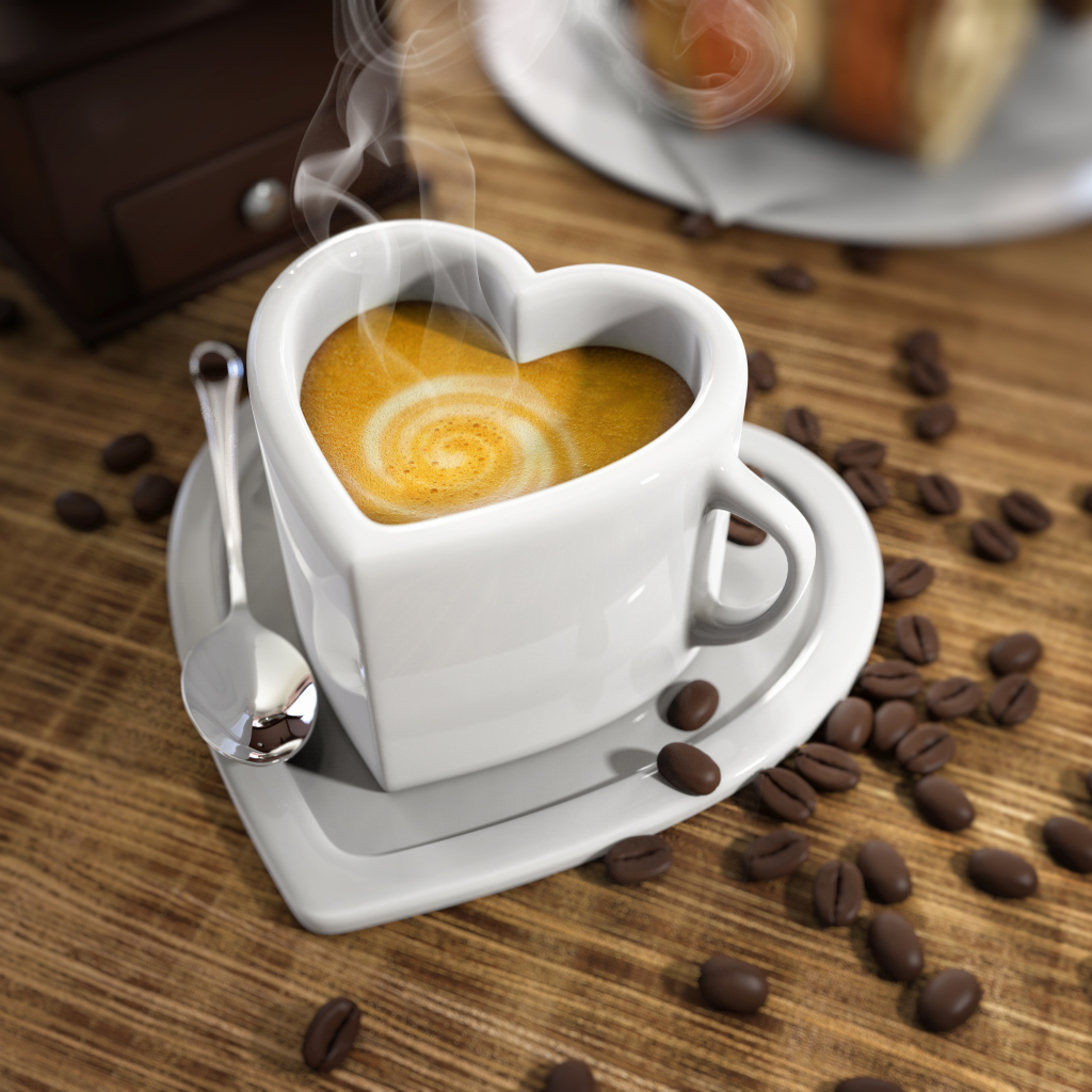 Белая красивая чашка в форме сердца на столе на зернами