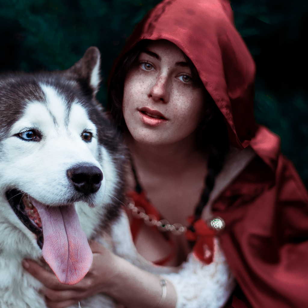 Девушка в красном плаще с собакой породы хаски