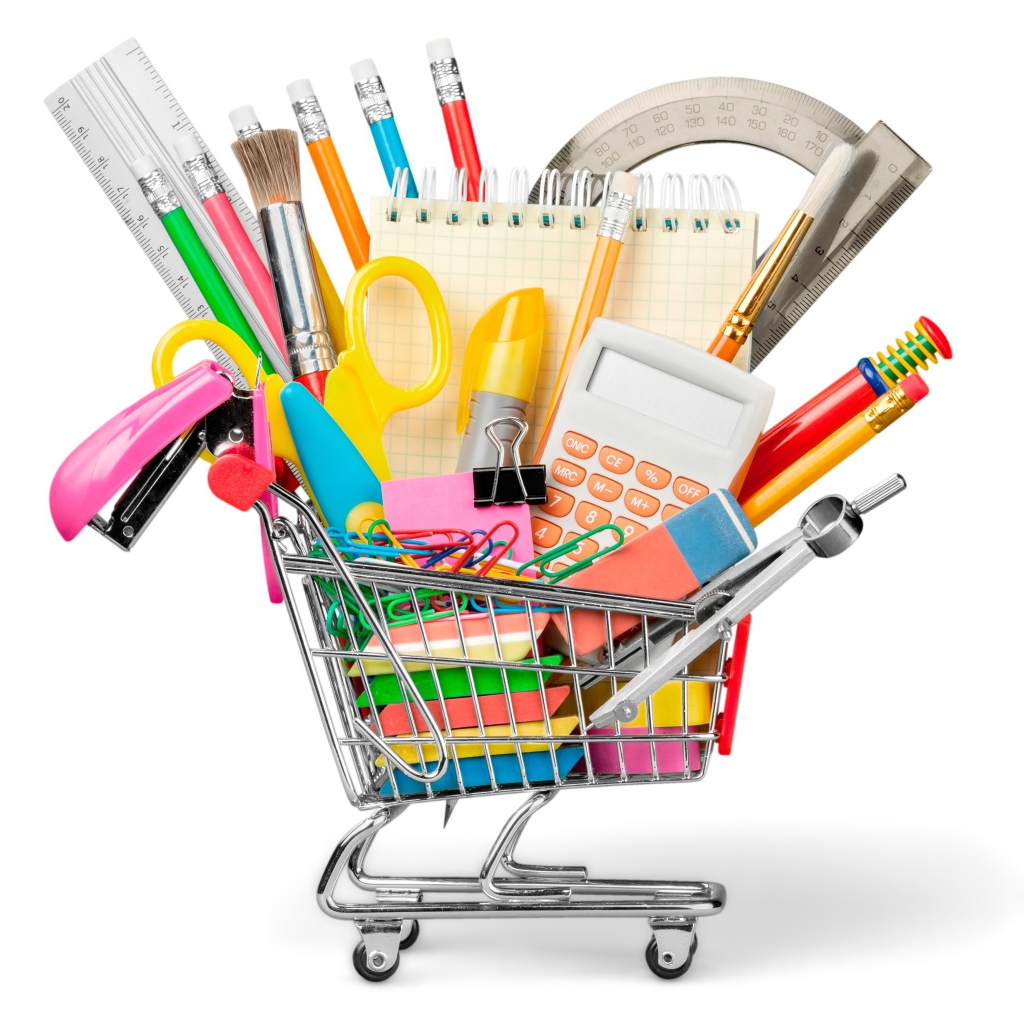 Канцелярские школьные принадлежности в тележке на белом фоне
