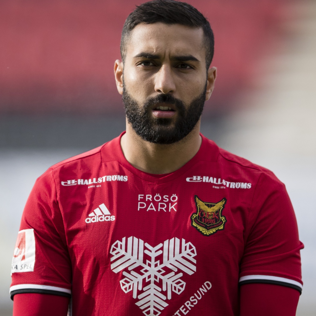 Football player Saman Goddos in red