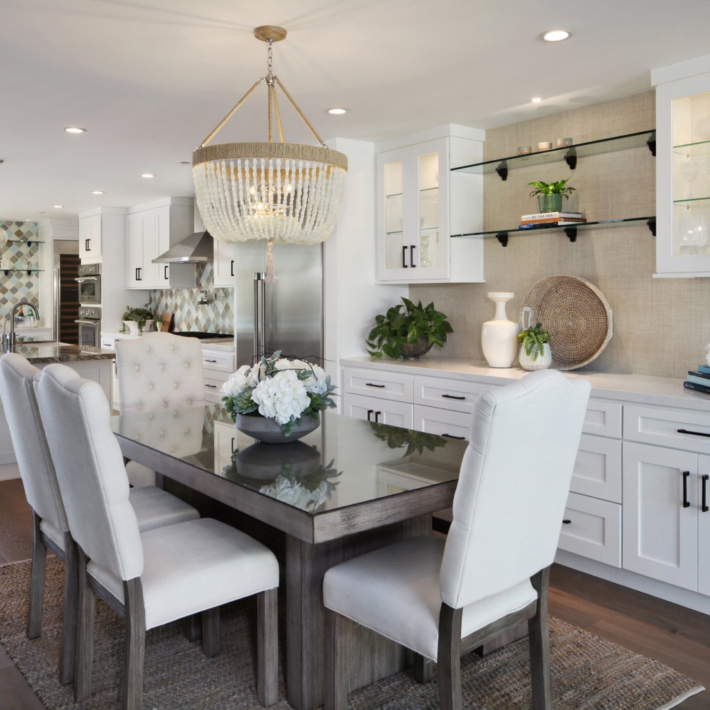 Kitchen with dining area with white furniture