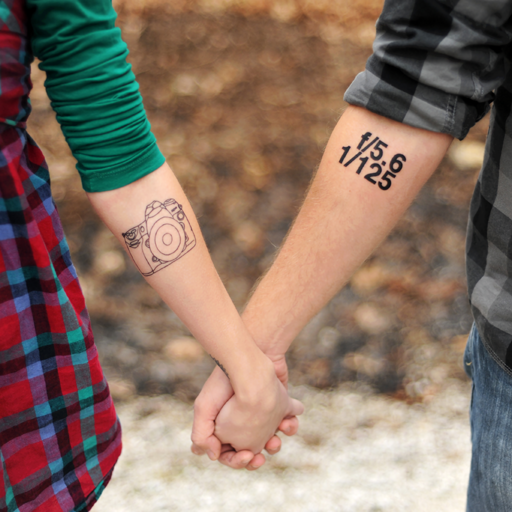 Tattoos on the hands of a couple in love