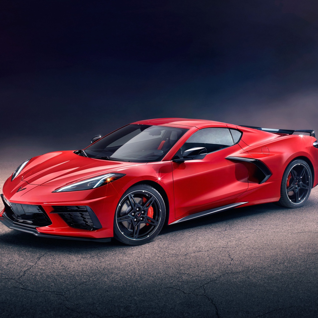Красный автомобиль Chevrolet Corvette Stingray Z51 Preserial  на сером фоне