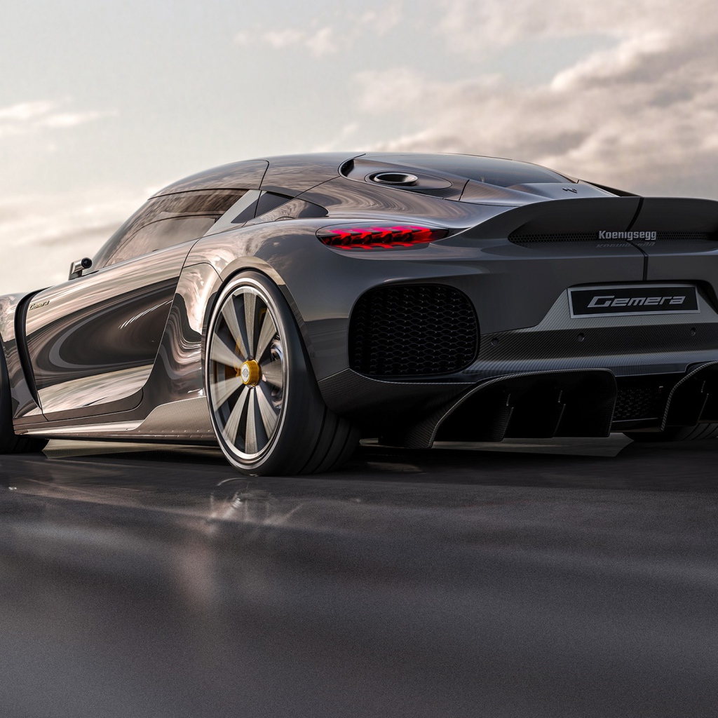 Быстрый автомобиль Koenigsegg Gemera 2020 года на трассе вид сзади