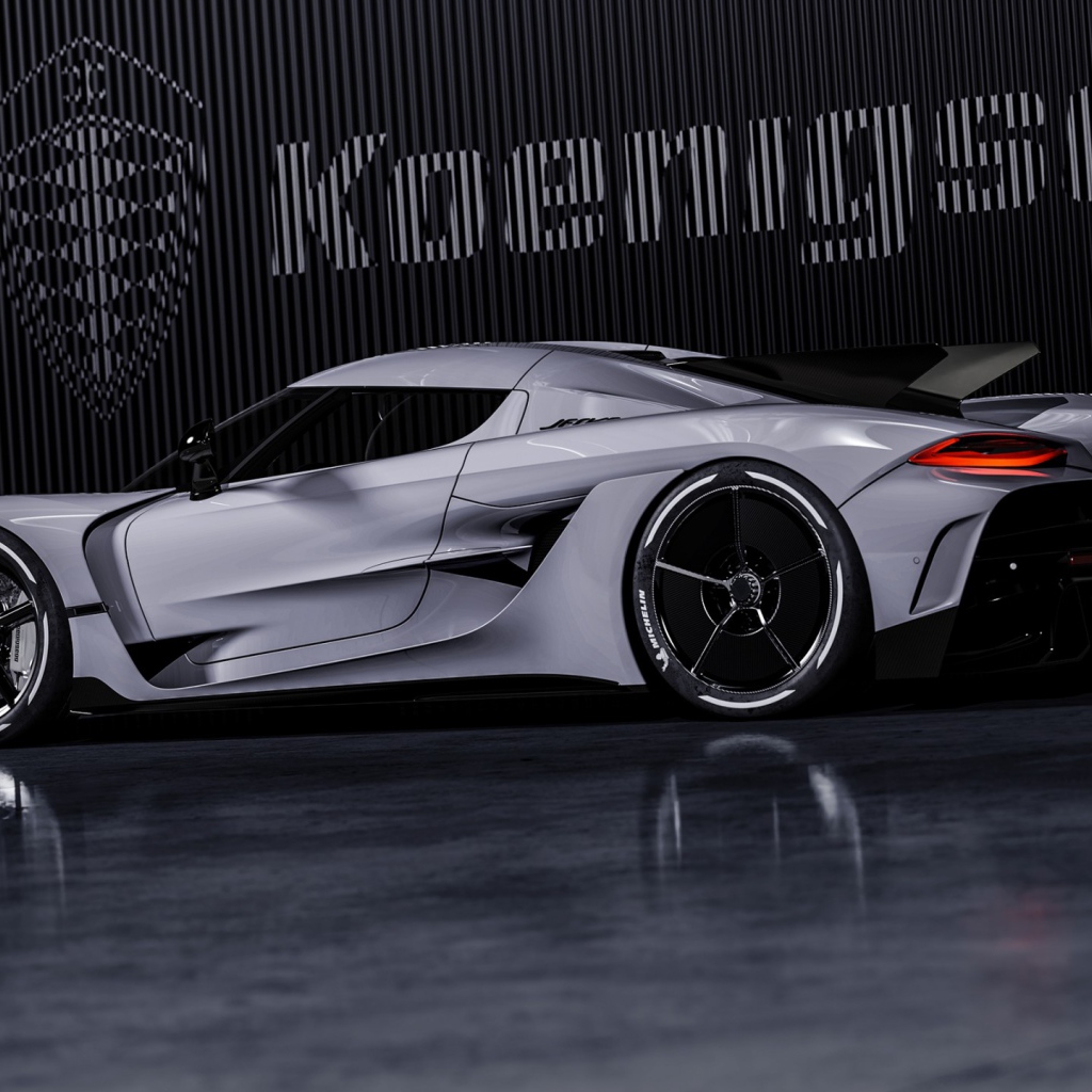 Автомобиль Koenigsegg Jesko Absolut 2020 года на фоне логотипа