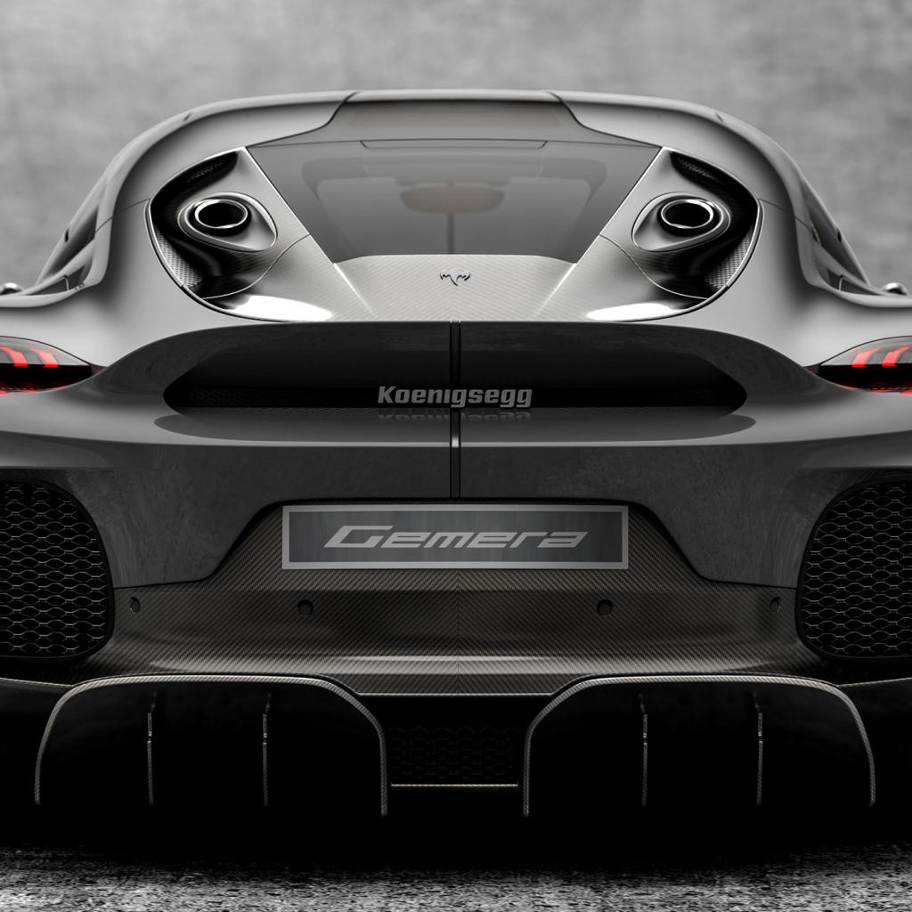 Серебристый автомобиль Koenigsegg Gemera 2020 года вид сзади