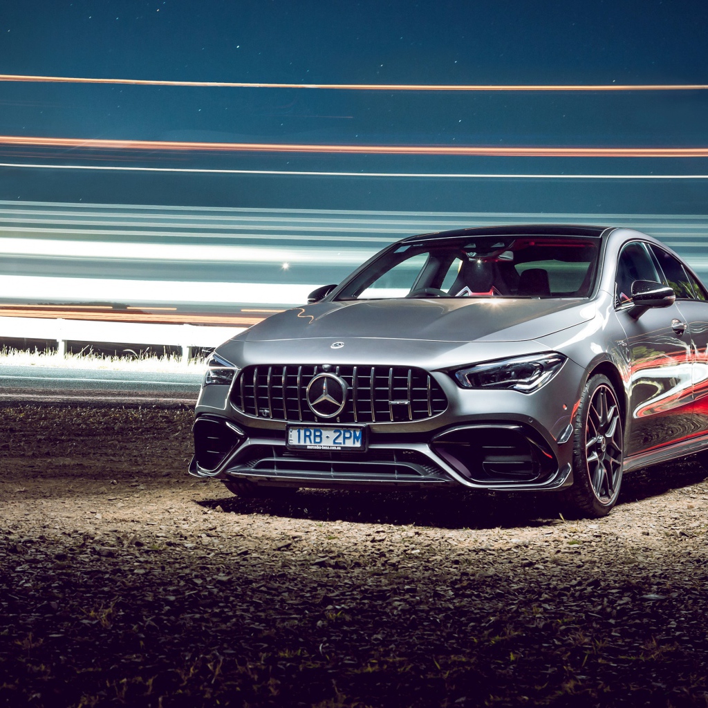 Серебристый автомобиль Mercedes-AMG CLA 45 S 4MATIC, 2020 года у трассы 