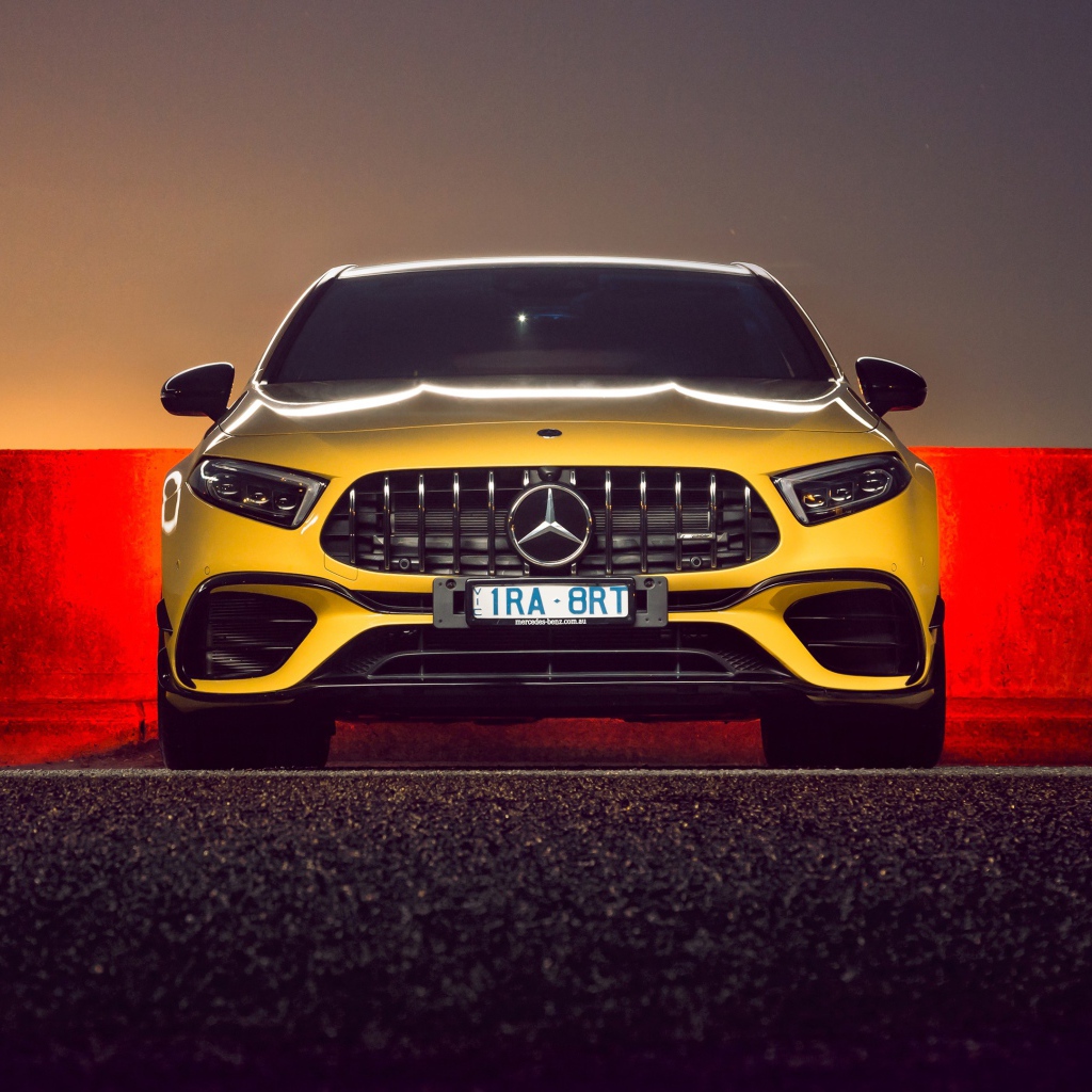 Желтый автомобиль Mercedes-AMG A 45 S,  2020 года вид спереди