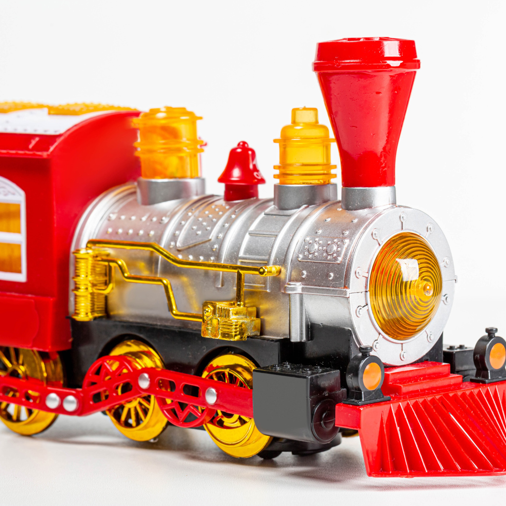 Children's toy steam engine on a white background