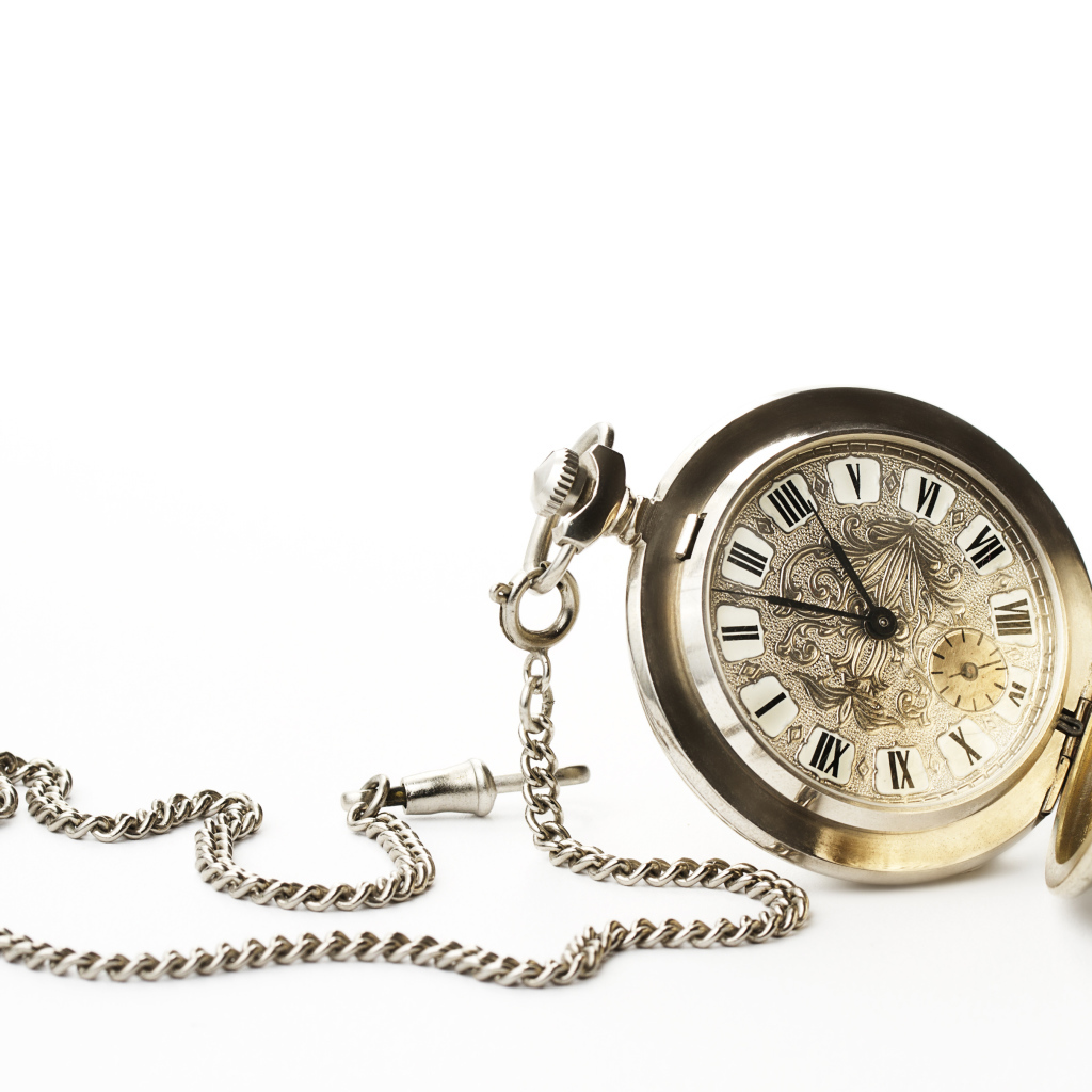 Old pocket watch on a chain on a white background
