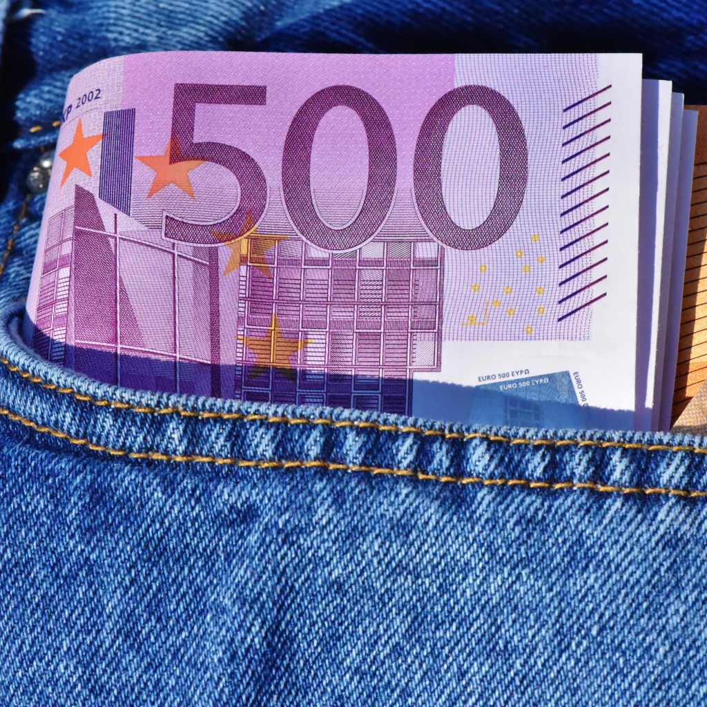 A bundle of euro bills in a pocket