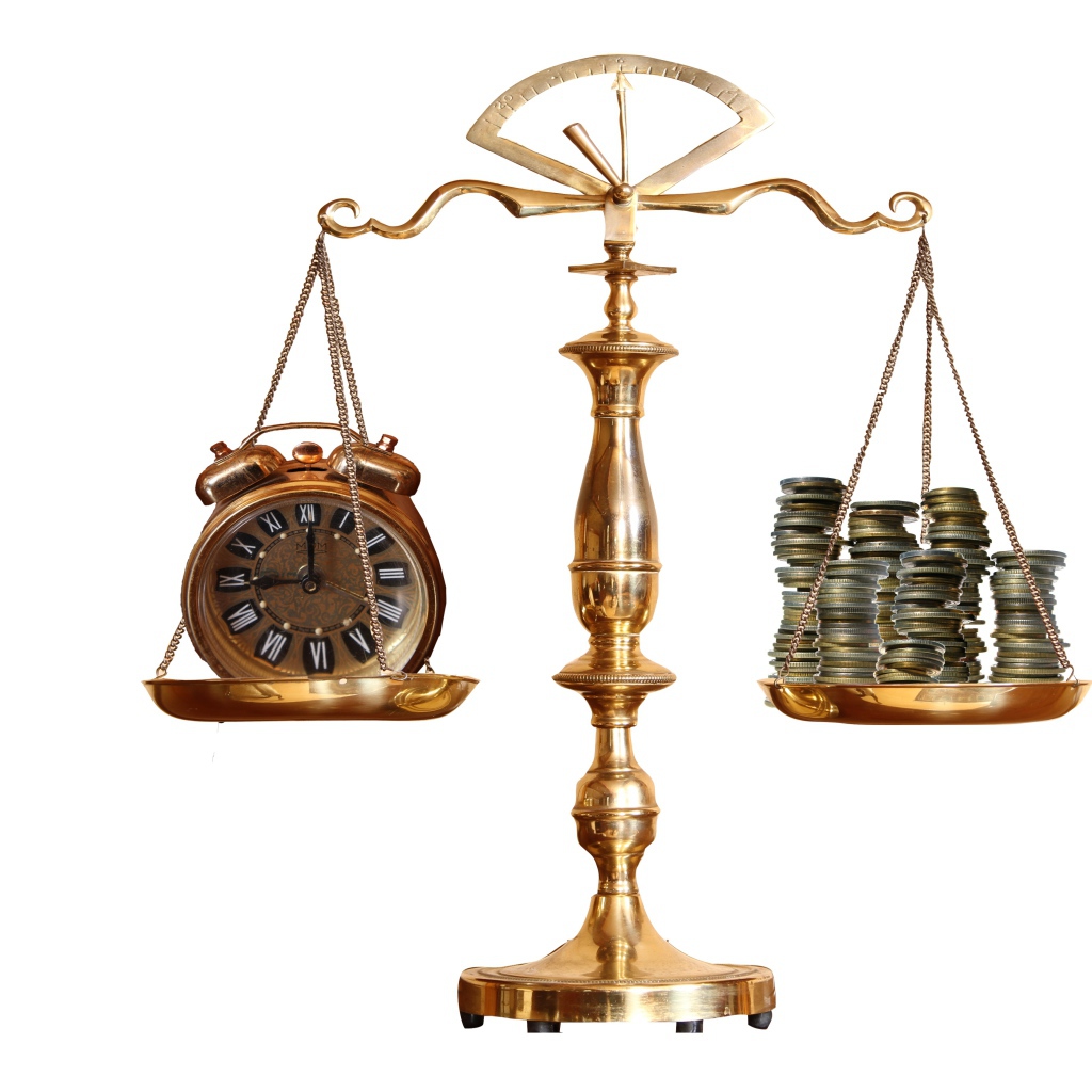 Scales with coins and watches on a white background