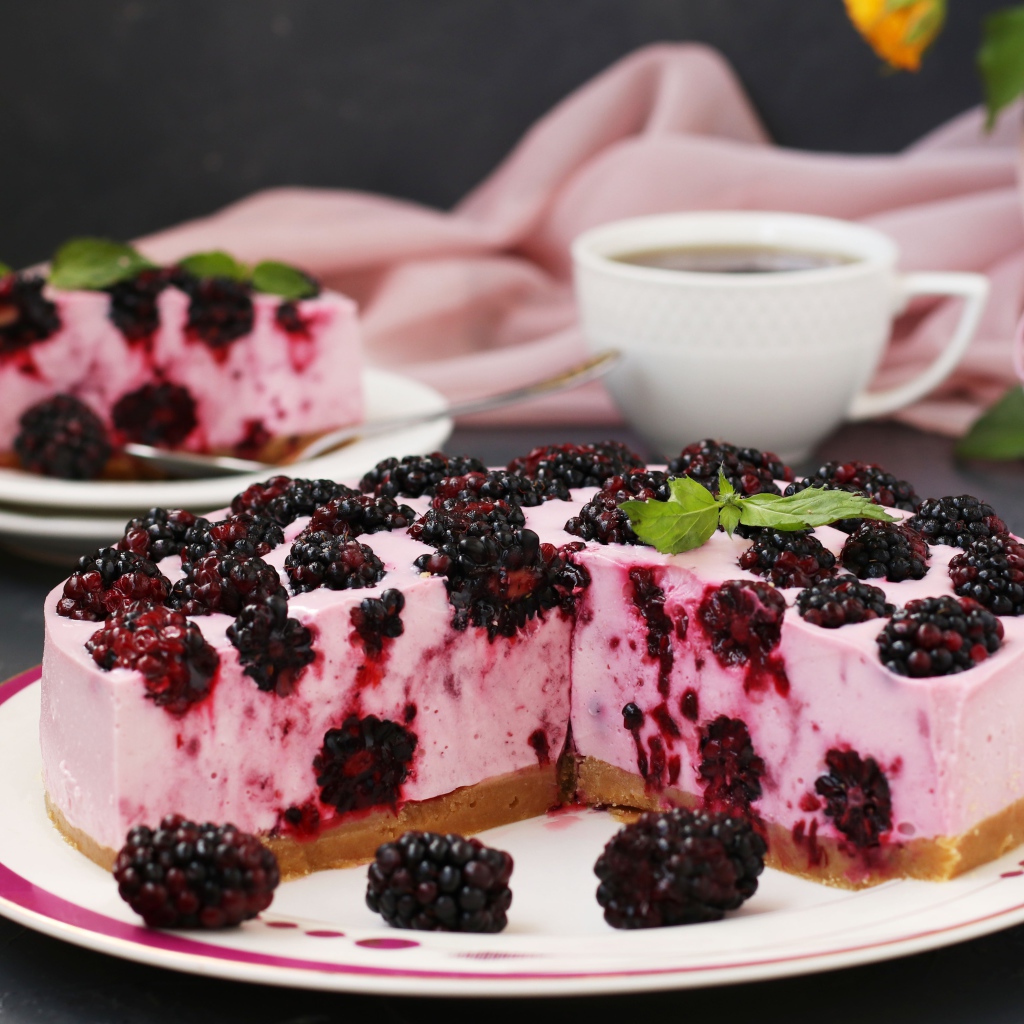 Cheesecake with blackberries on a large plate