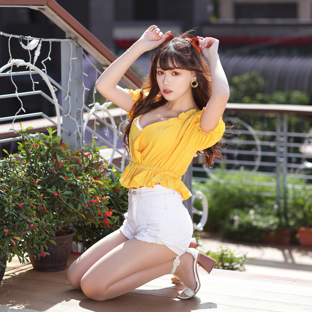 Cute asian girl in short white shorts