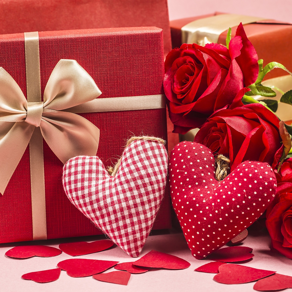 Two gifts with red roses and fabric hearts