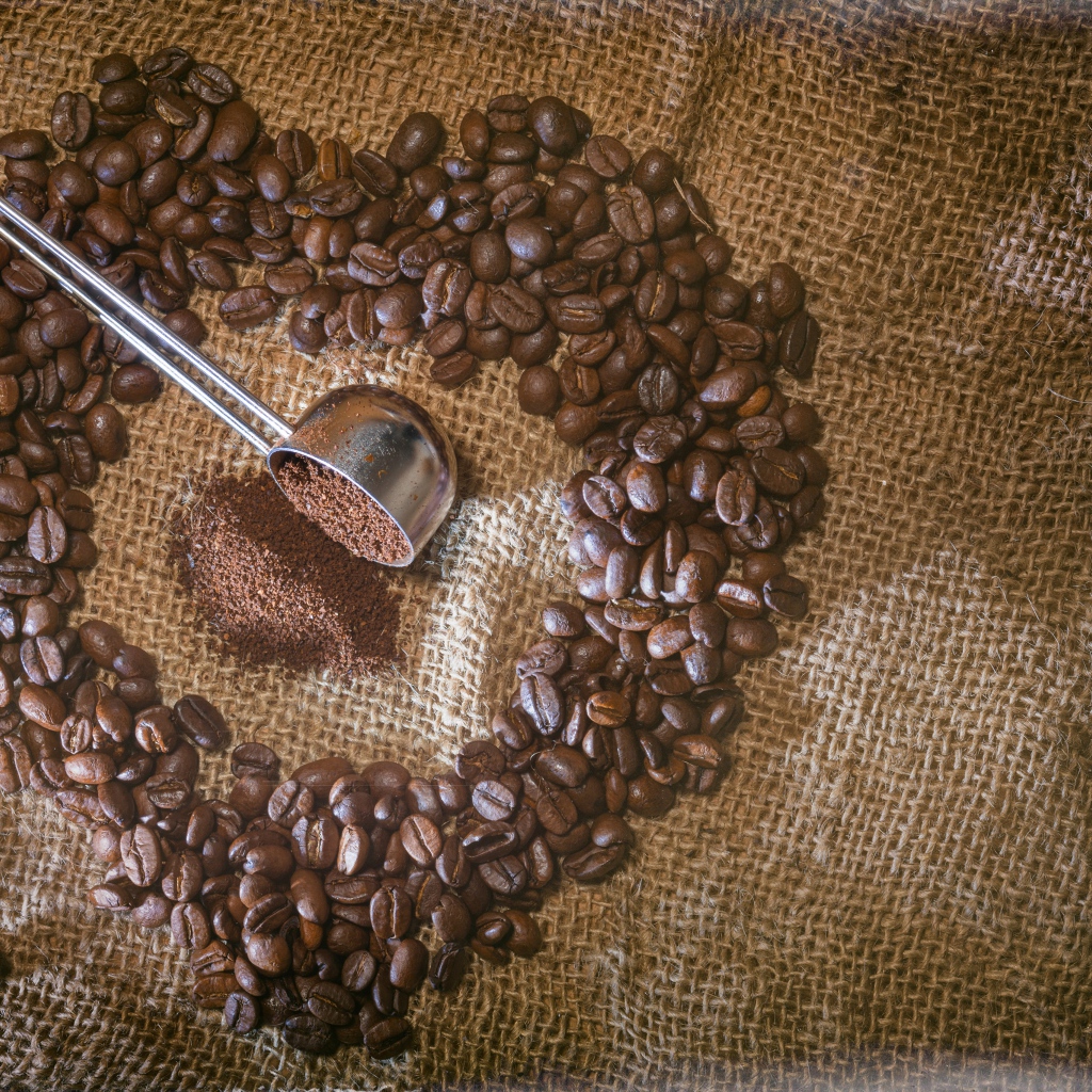 Heart made of coffee beans on a bag
