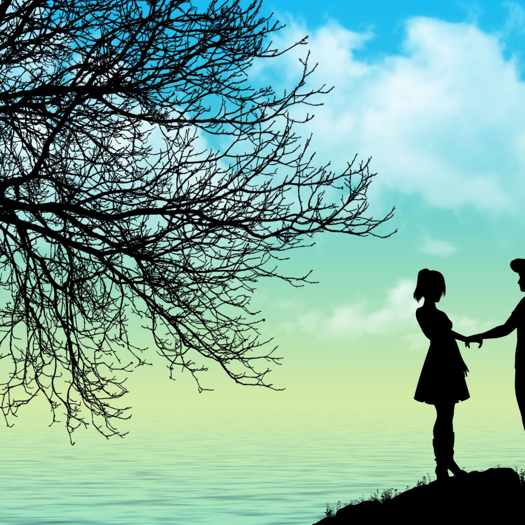 Силуэт влюбленной пары у дерева на берегу моря