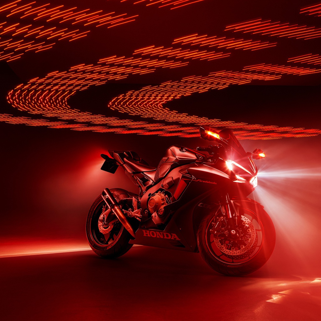 Honda Fireblade motorcycle on a red background
